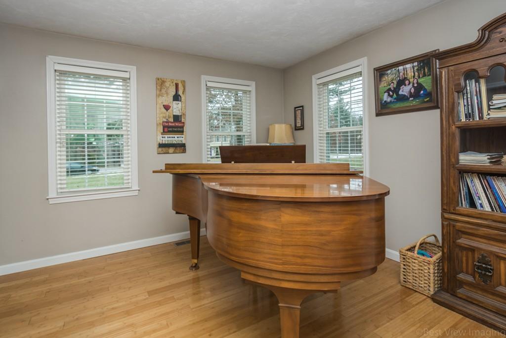 41 Tannery Road Sturbridge, MA 01518 - Photo 20 of 42 a room with wooden floor and a window