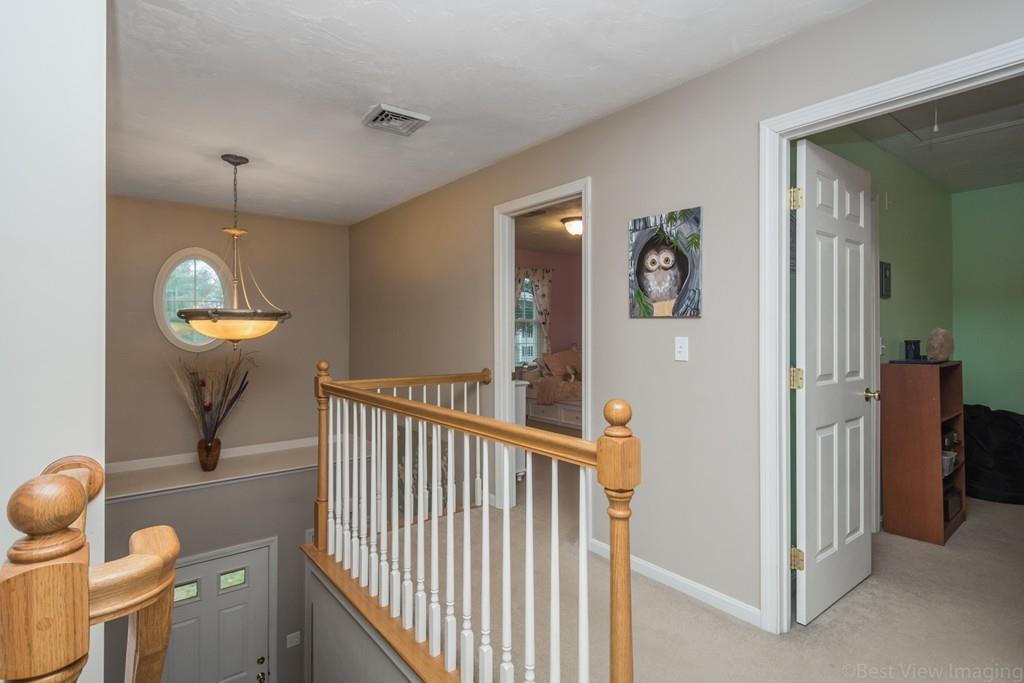 41 Tannery Road Sturbridge, MA 01518 - Photo 25 of 42 a view of a hallway and a livingroom with furniture