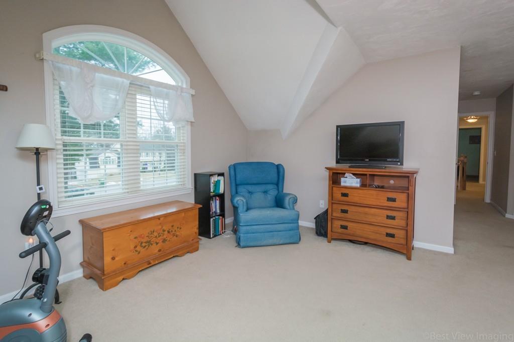 41 Tannery Road Sturbridge, MA 01518 - Photo 29 of 42 a living room with furniture and a flat screen tv