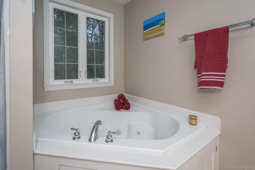 41 Tannery Road Sturbridge, MA 01518 - Photo 31 of 42 a bathroom with a bathtub and a window