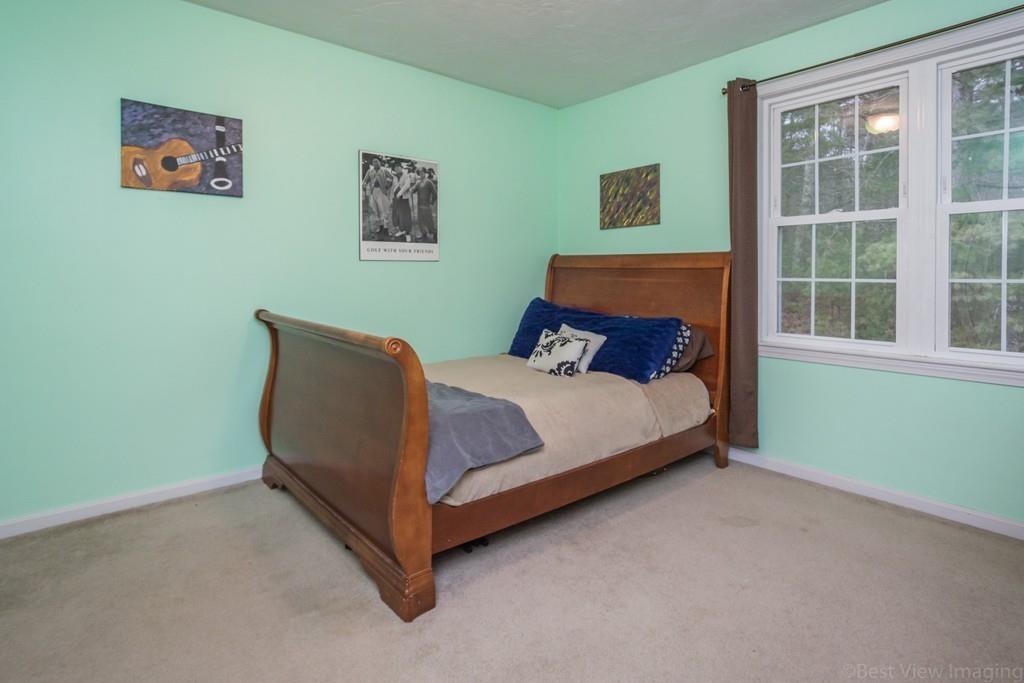41 Tannery Road Sturbridge, MA 01518 - Photo 34 of 42 a bed sitting in a bedroom next to a window