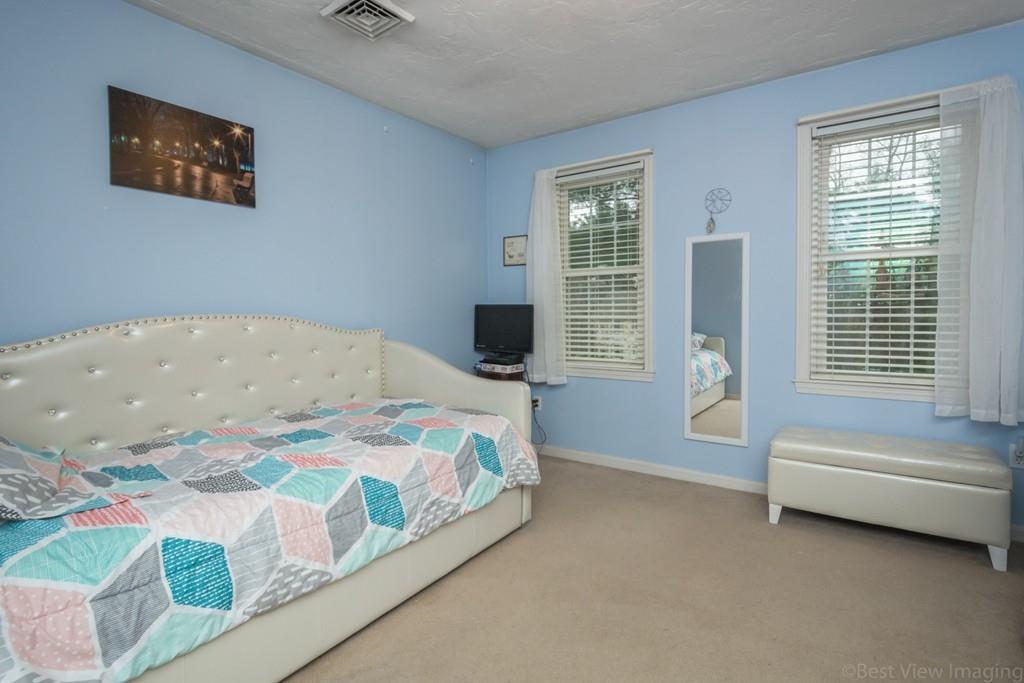 41 Tannery Road Sturbridge, MA 01518 - Photo 35 of 42 a bedroom with a bed and a couch