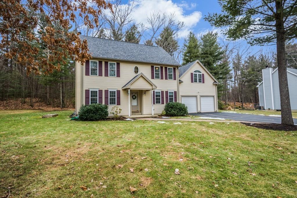 41 Tannery Road Sturbridge, MA 01518 - Photo 40 of 42 a front view of a house with a garden