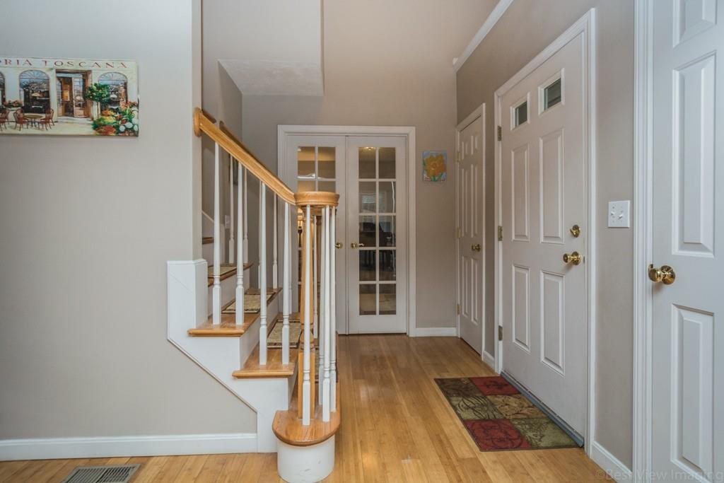 41 Tannery Road Sturbridge, MA 01518 - Photo 5 of 42 a view of a hallway with wooden floor and entryway