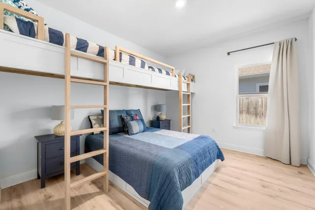 a bedroom with a bed and a cabinets