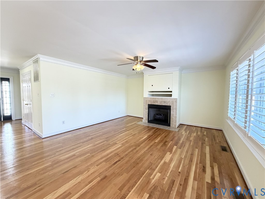10911 Weybridge Road Chester, VA 23831 - Photo 12 of 38 wooden floor fireplace and natural light in room