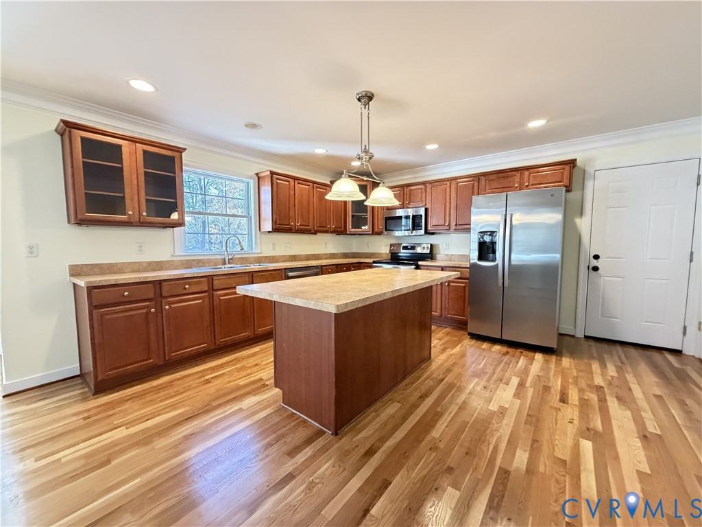 10911 Weybridge Road Chester, VA 23831 - Photo 17 of 38 a large kitchen with stainless steel appliances granite countertop a stove and a sink