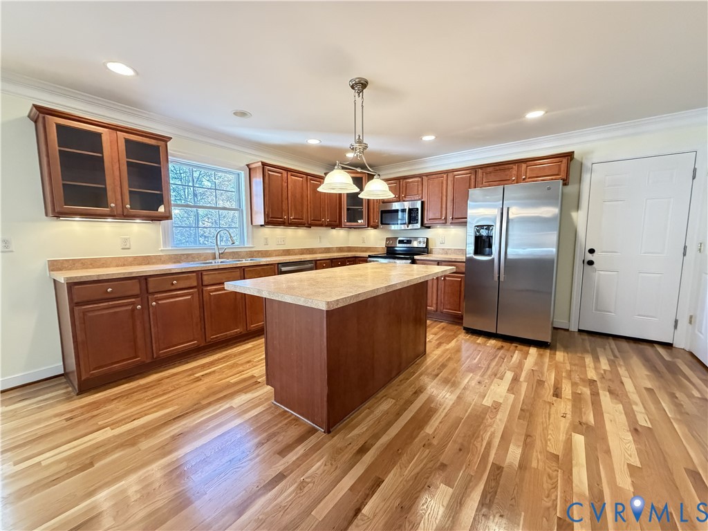 10911 Weybridge Road Chester, VA 23831 - Photo 21 of 38 a kitchen with stainless steel appliances granite countertop a sink a stove and a refrigerator