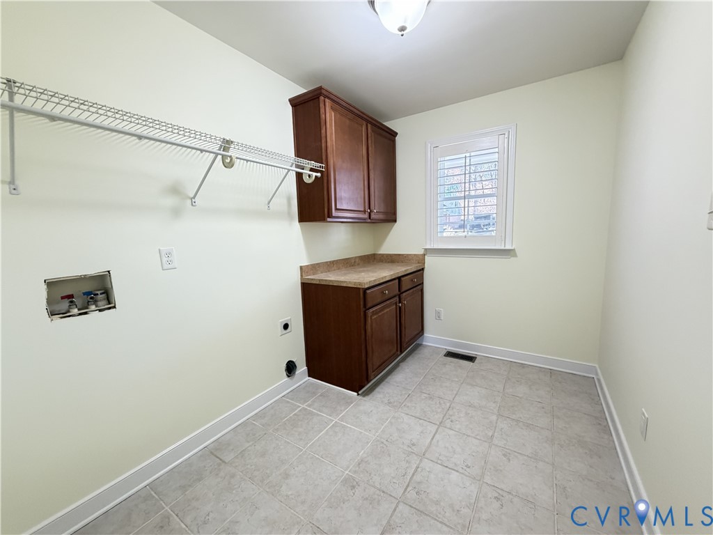 10911 Weybridge Road Chester, VA 23831 - Photo 24 of 38 a view of a refrigerator in a kitchen