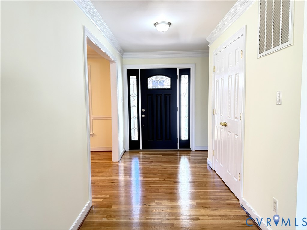10911 Weybridge Road Chester, VA 23831 - Photo 27 of 38 a view of a hallway with wooden floor