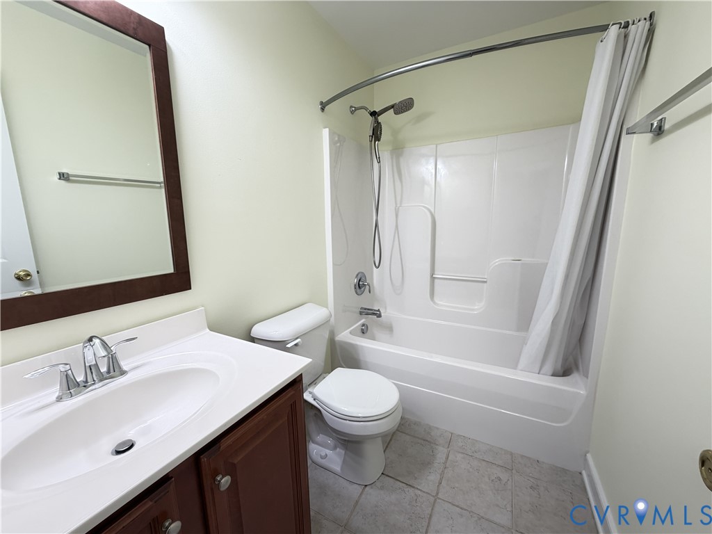 10911 Weybridge Road Chester, VA 23831 - Photo 29 of 38 a bathroom with a sink a toilet and a mirror