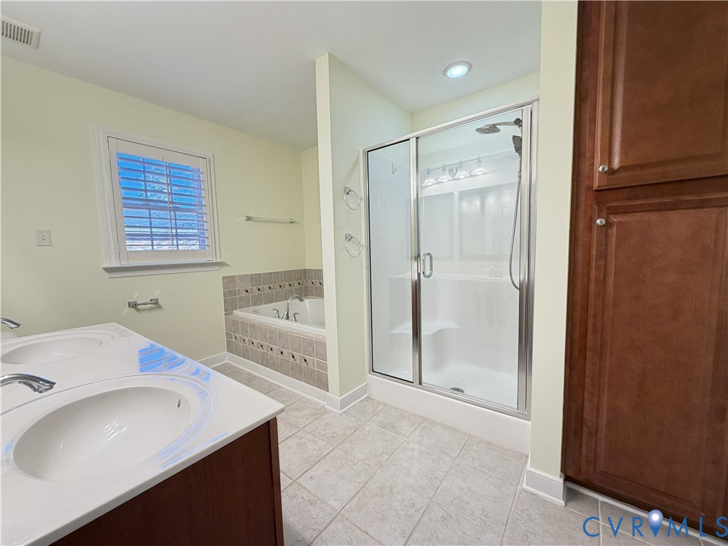 10911 Weybridge Road Chester, VA 23831 - Photo 31 of 38 a bathroom with a sink a toilet and shower