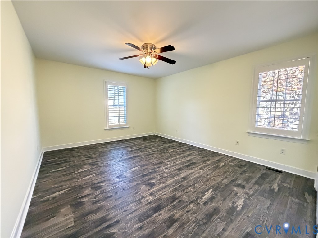 10911 Weybridge Road Chester, VA 23831 - Photo 37 of 38 a view of empty room with wooden floor and fan