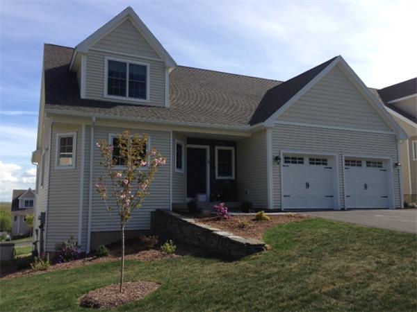 20 Bridge Road, Unit 6 Northampton, MA 01062 - Photo 1 of 1 a front view of a house with a yard