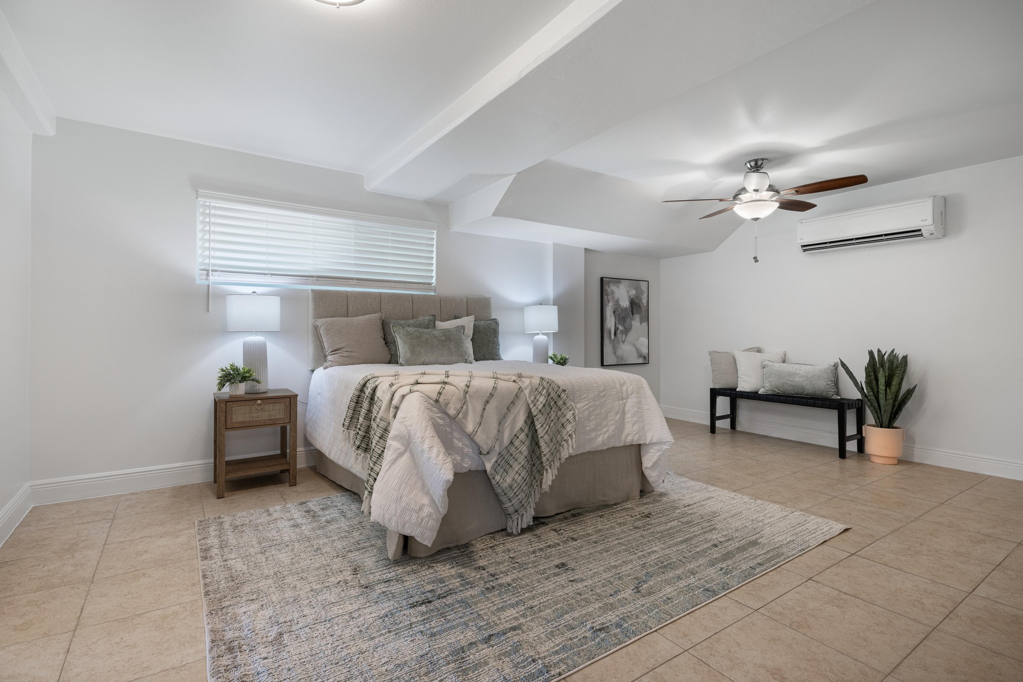 13566 Bullick Hollow Road Austin, TX 78726 - Photo 21 of 32 a bed room with a bed and a chandelier
