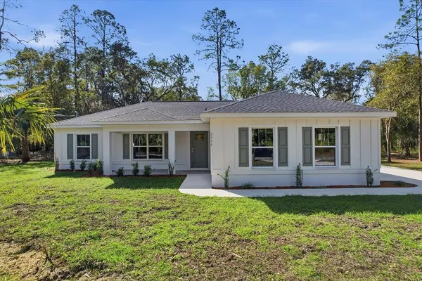 front view of a house with a garden
