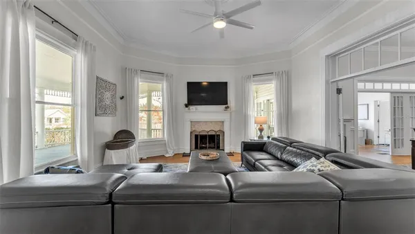 a living room with furniture fireplace and flat screen tv