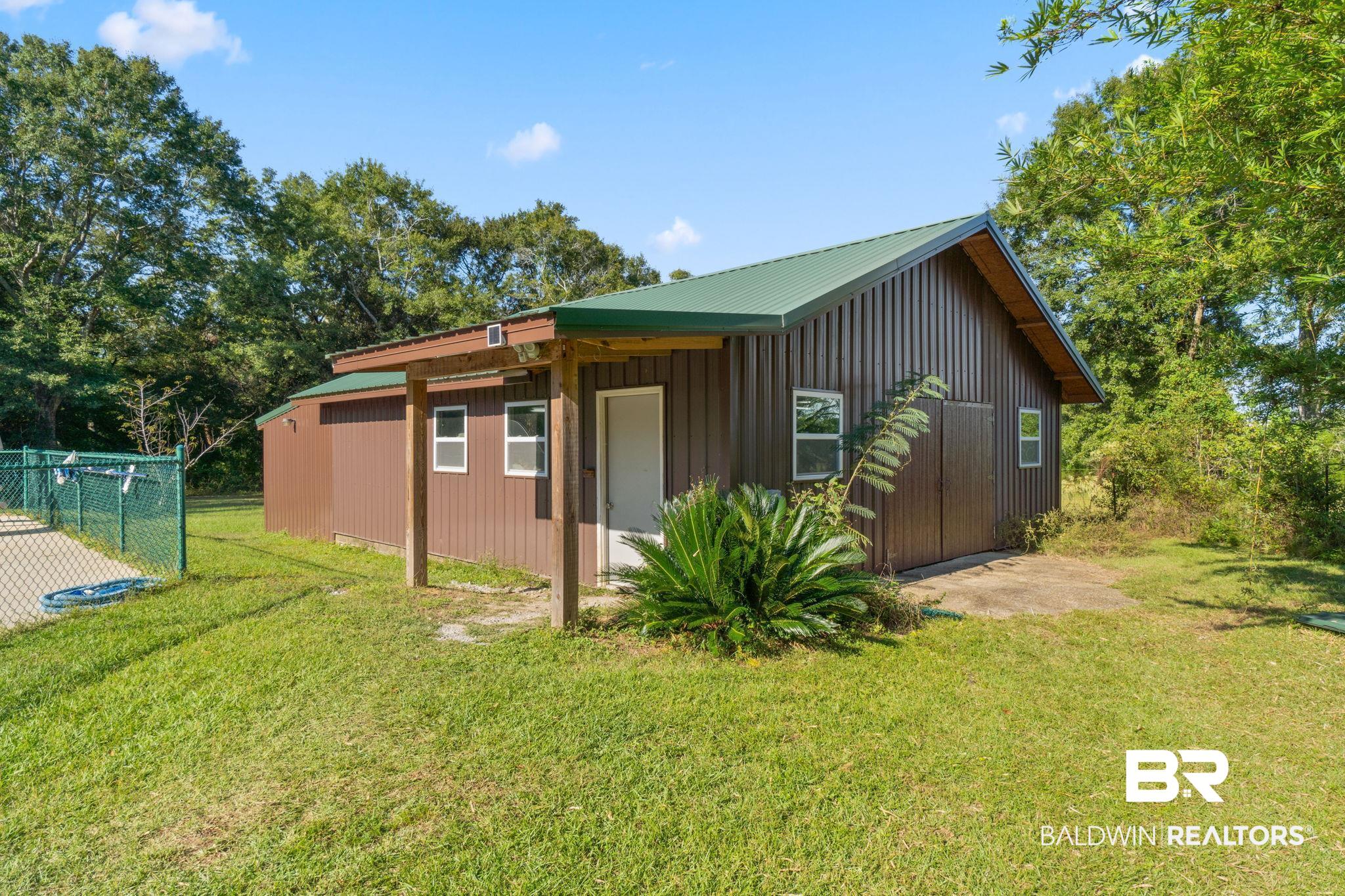 27300 C R Watson Road Robertsdale, AL 36567 - Photo 29 of 35 View of side of home with a yard