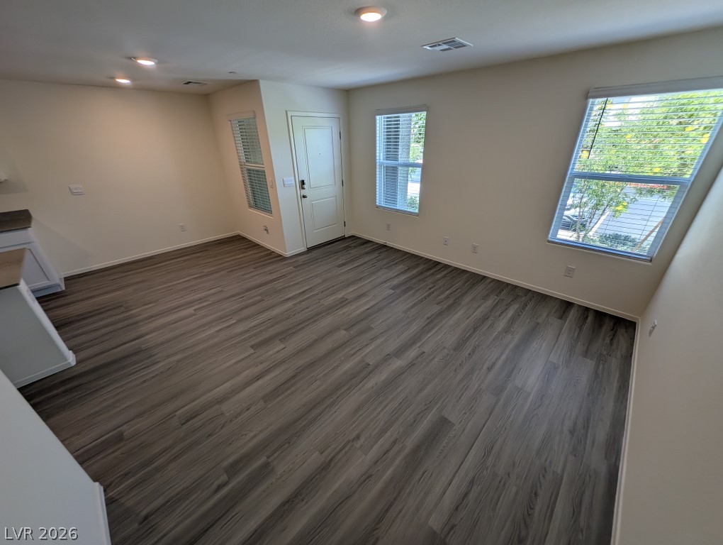 4820 Orchid Rdg Avenue Las Vegas, NV 89141 - Photo 4 of 27 Natural light filters into this spacious living area with resilient flooring.
