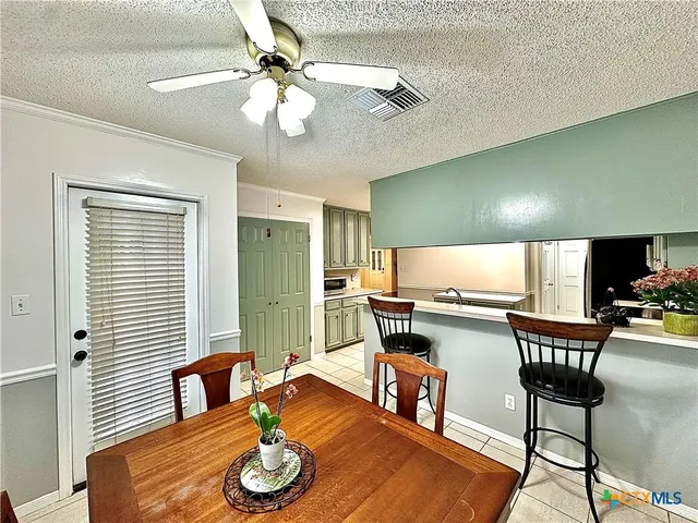 a spacious bathroom with a double vanity sink mirror and bathtub
