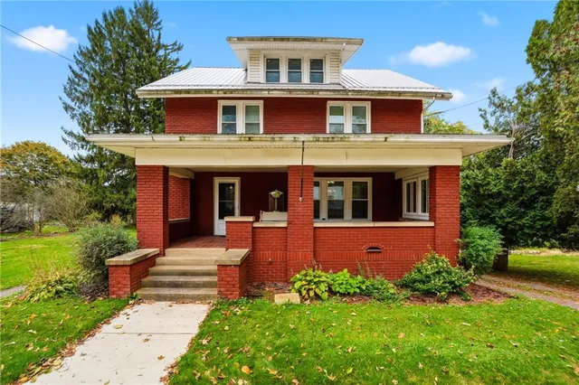 front view of a house with a yard