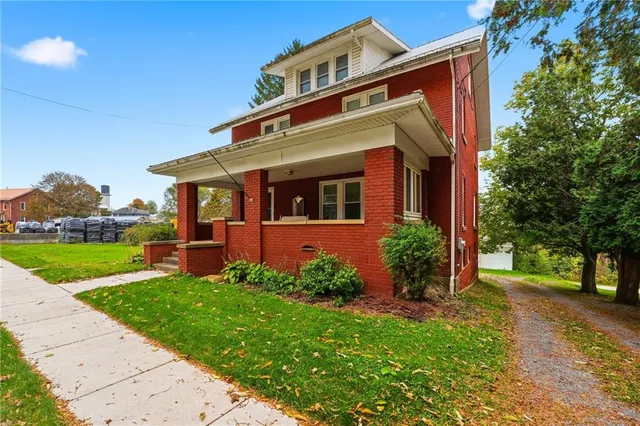front view of a house with a yard