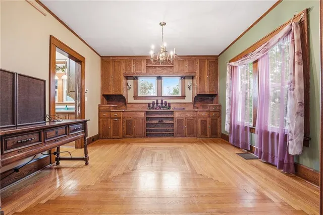 a kitchen with stainless steel appliances a sink and a microwave