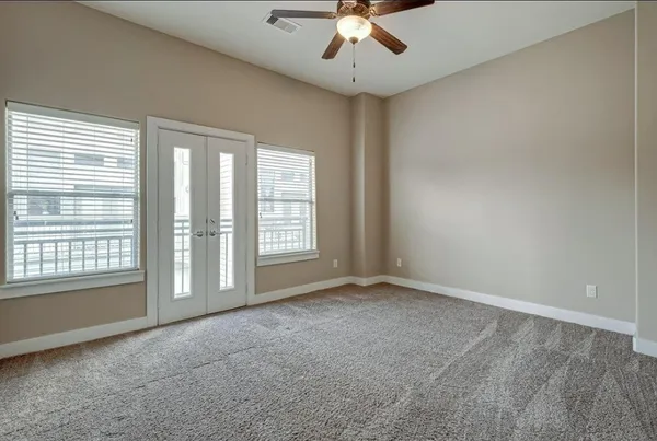 a view of an empty room with a window