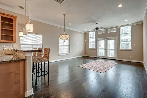a view of a livingroom with furniture window and wooden floor