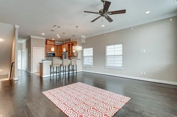 an open kitchen with a table and chairs in it
