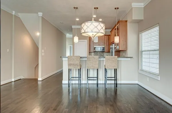 a view of kitchen with furniture and wooden floor