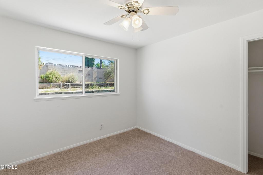1290 Lawrence Circle Simi Valley, CA 93065 - Photo 15 of 37 an empty room with a window and a fan