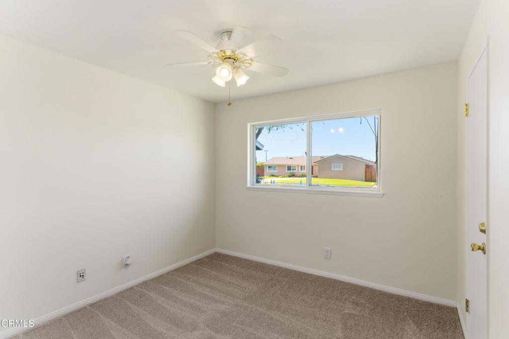 1290 Lawrence Circle Simi Valley, CA 93065 - Photo 22 of 37 an empty room with a chandelier fan
