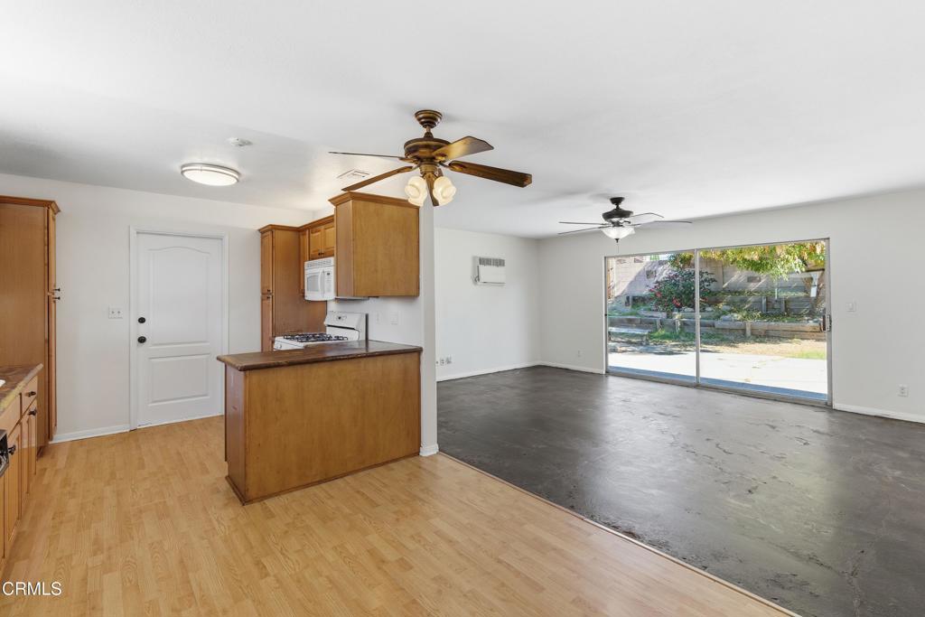 1290 Lawrence Circle Simi Valley, CA 93065 - Photo 5 of 37 a view of a kitchen with a sink hardwood floor and a window