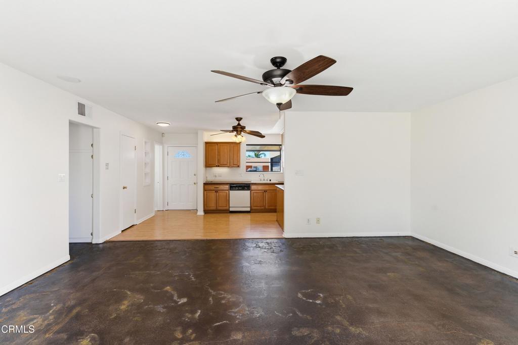 1290 Lawrence Circle Simi Valley, CA 93065 - Photo 7 of 37 a view of a room with wooden floor and a ceiling fan