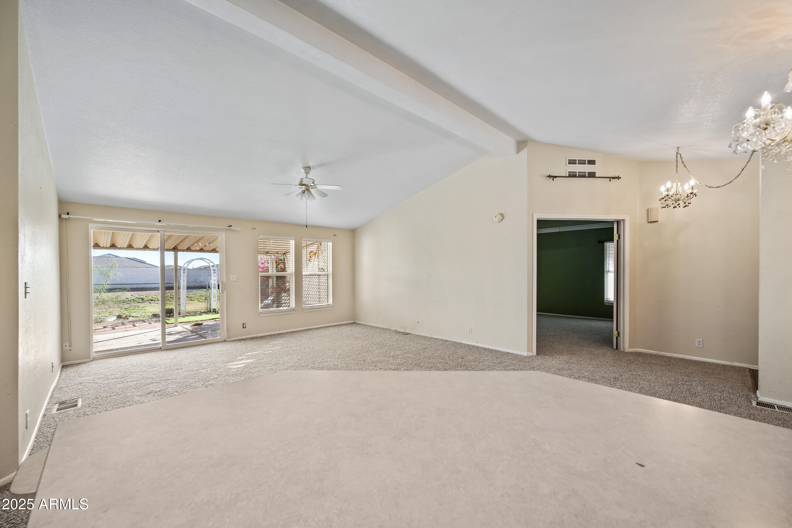 2101 South Meridian Road, Unit 49 Apache Junction, AZ 85120 - Photo 12 of 42 an empty room with windows and cabinet