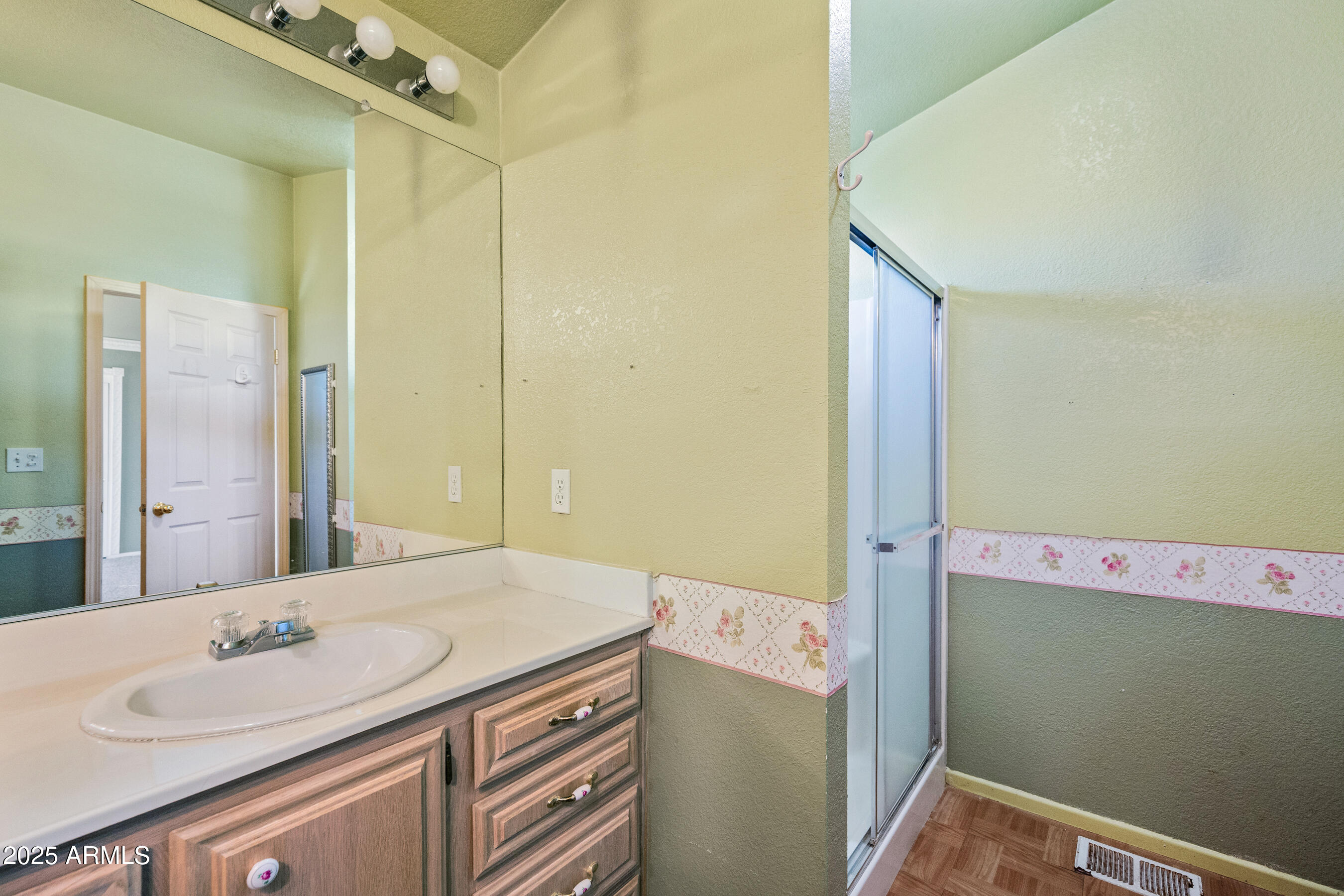 2101 South Meridian Road, Unit 49 Apache Junction, AZ 85120 - Photo 19 of 42 a bathroom with a sink and a mirror