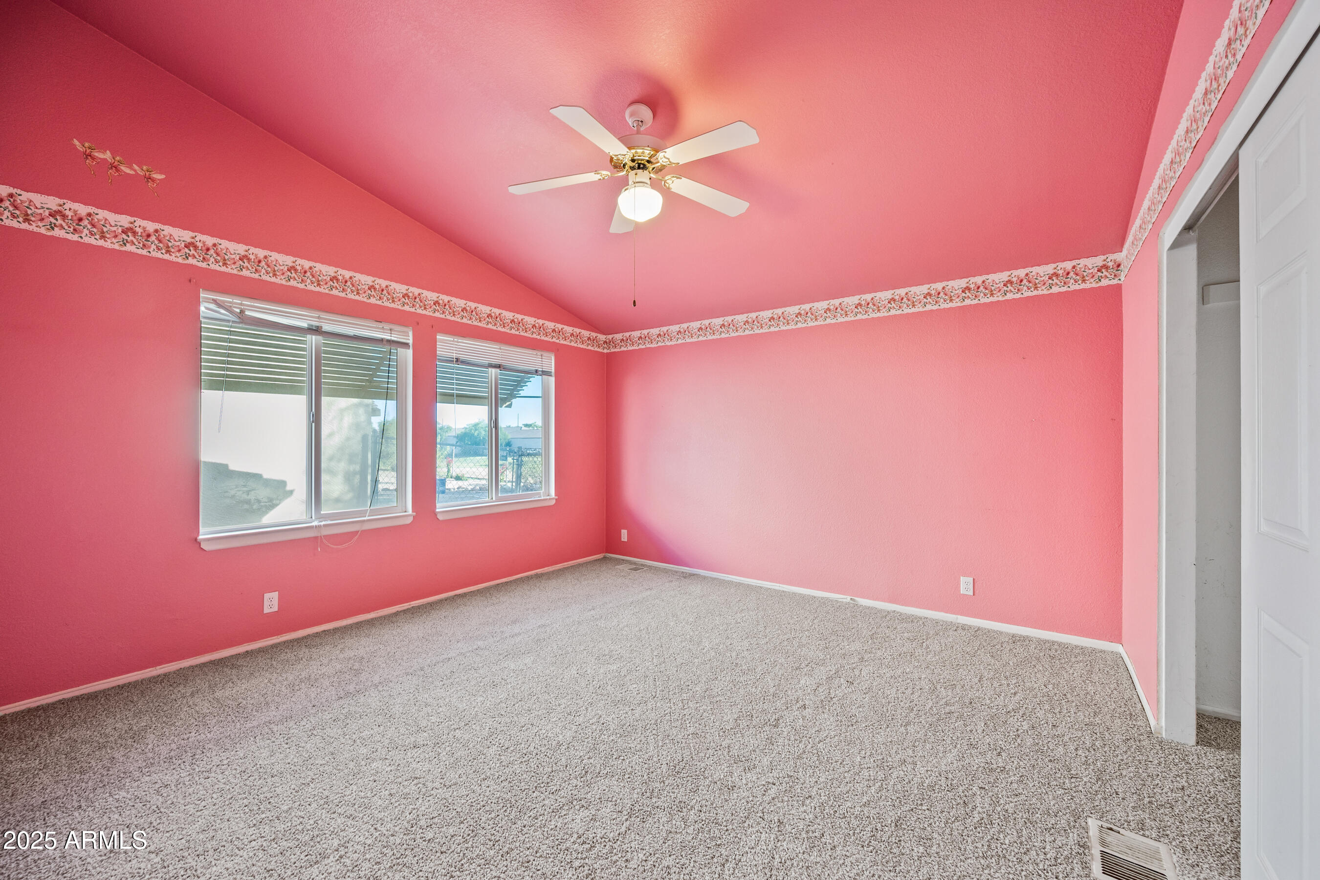 2101 South Meridian Road, Unit 49 Apache Junction, AZ 85120 - Photo 20 of 42 a view of a livingroom with a ceiling fan and window