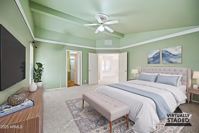 a bedroom with a bed and a chandelier