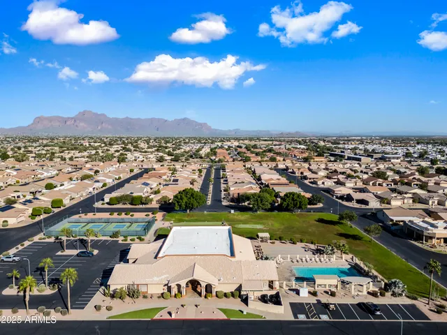 an aerial view of residential houses with outdoor space