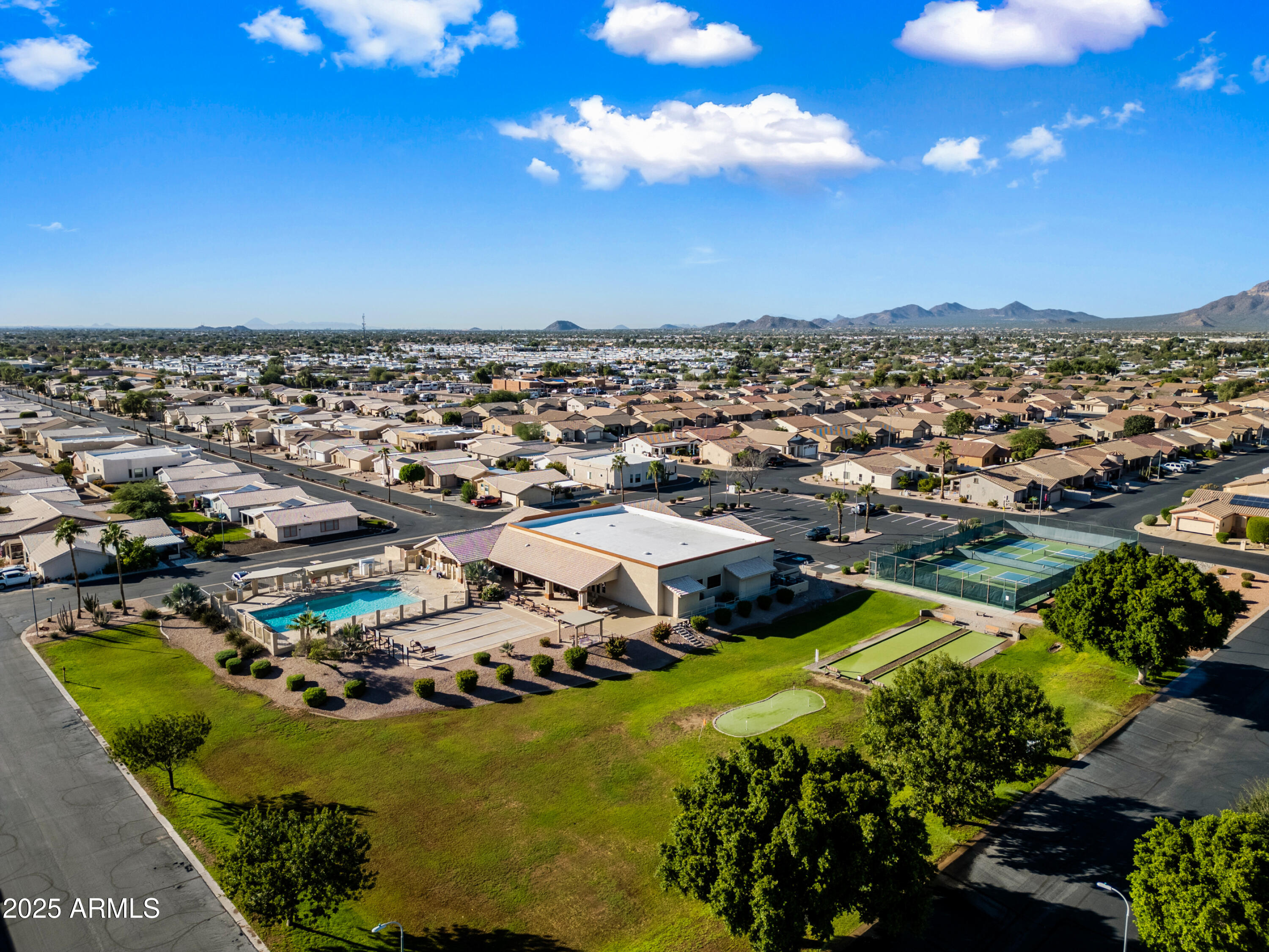 2101 South Meridian Road, Unit 49 Apache Junction, AZ 85120 - Photo 28 of 42 an aerial view of residential houses with outdoor space