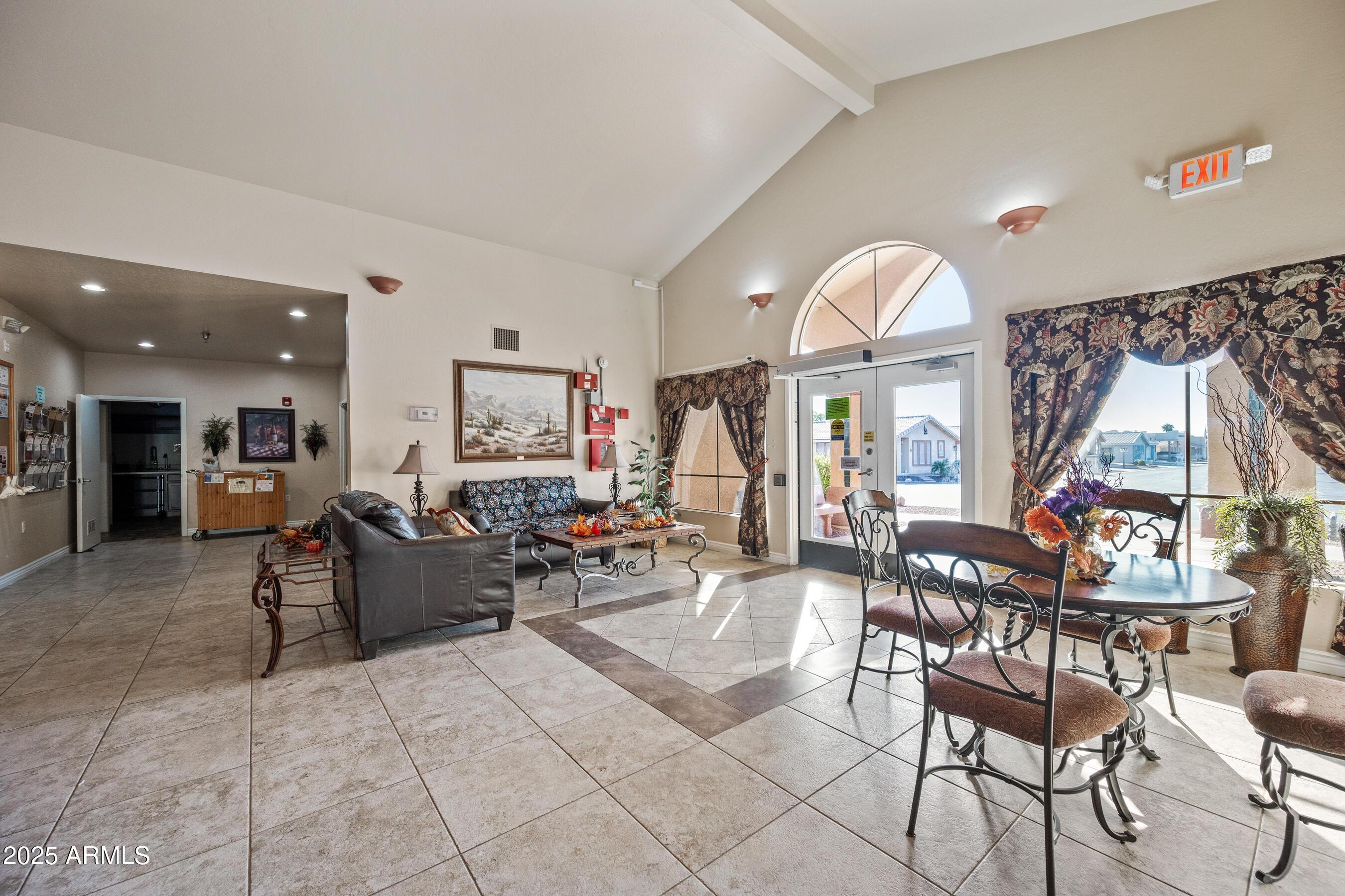 2101 South Meridian Road, Unit 49 Apache Junction, AZ 85120 - Photo 35 of 44 a view of a dining room with furniture a rug and wooden floor