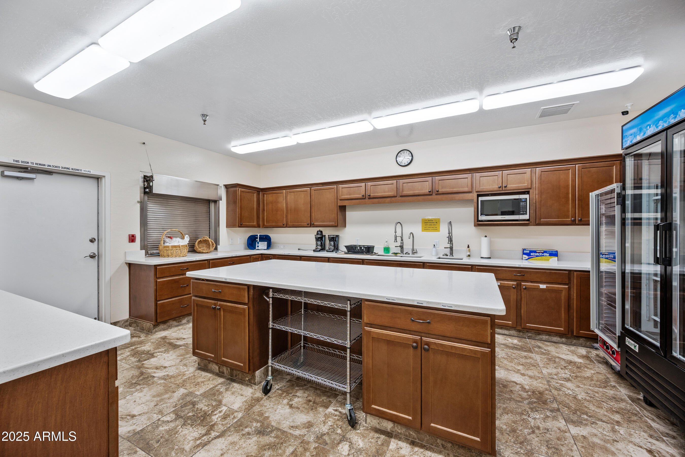 2101 South Meridian Road, Unit 49 Apache Junction, AZ 85120 - Photo 44 of 44 a kitchen with stainless steel appliances a sink and cabinets