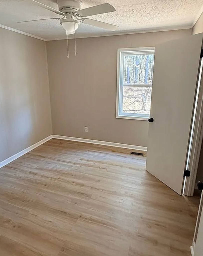 21 River Rd Drive Blairsville, GA 30512 - Photo 12 of 39 wooden floor in an empty room with a window