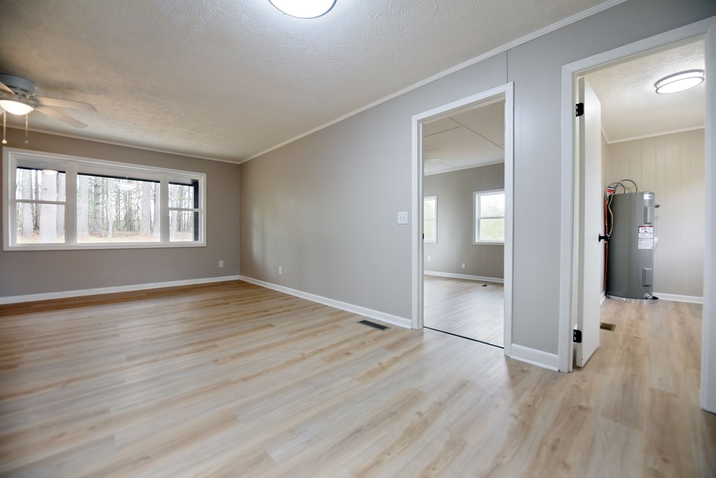 21 River Rd Drive Blairsville, GA 30512 - Photo 21 of 39 wooden floor in an empty room with a window
