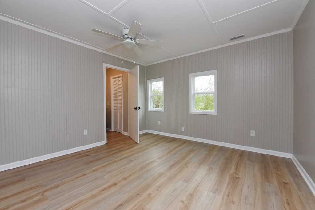 21 River Rd Drive Blairsville, GA 30512 - Photo 22 of 39 a view of an empty room with wooden floor and a window