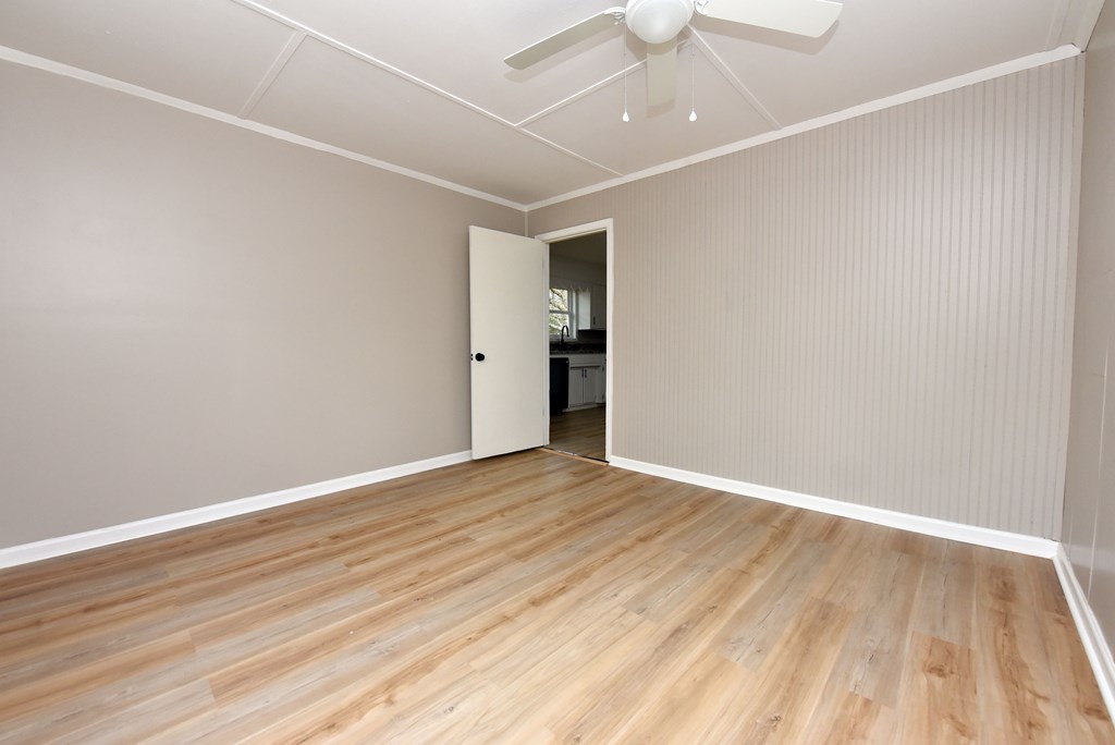 21 River Rd Drive Blairsville, GA 30512 - Photo 25 of 39 an empty room with wooden floor and windows