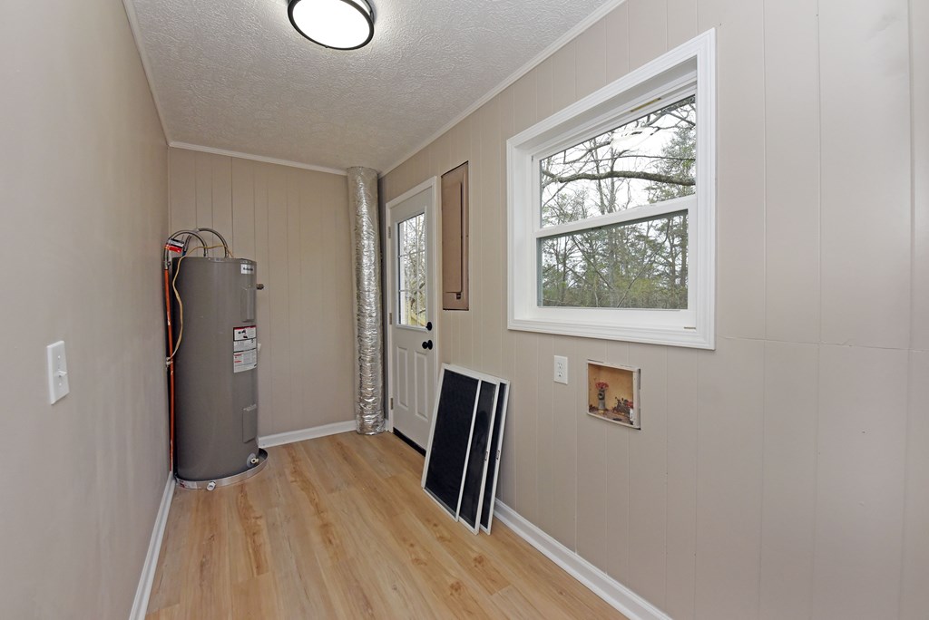 21 River Rd Drive Blairsville, GA 30512 - Photo 26 of 39 a view of hallway with windows and wooden floor