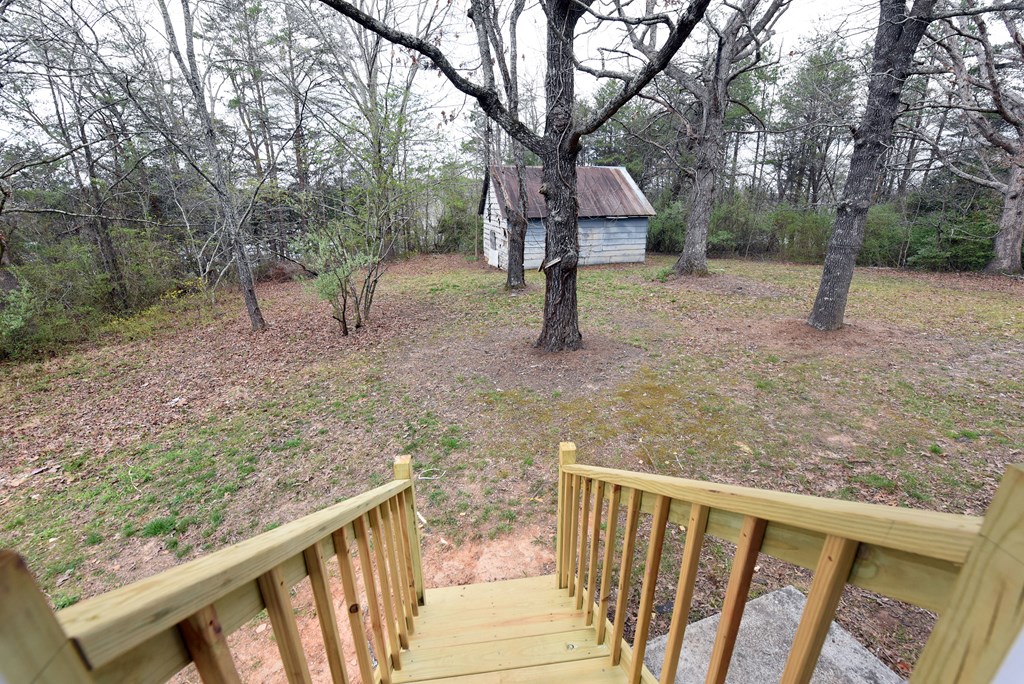 21 River Rd Drive Blairsville, GA 30512 - Photo 27 of 39 a view of a bench in the forest
