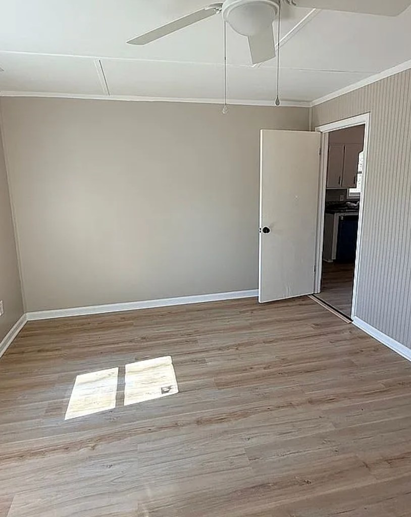 21 River Rd Drive Blairsville, GA 30512 - Photo 7 of 39 a view of empty room with wooden floor and fan